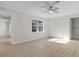 Bright bedroom featuring modern ceiling fan, a window, and neutral walls at 2483 Morlynn Dr., Myrtle Beach, SC 29577