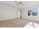 Bright bedroom featuring modern ceiling fan, a window, and neutral walls at 2483 Morlynn Dr., Myrtle Beach, SC 29577