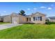 Charming single-story home features a well-manicured lawn, attached garage, and inviting curb appeal at 2483 Morlynn Dr., Myrtle Beach, SC 29577