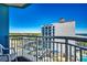 Balcony view of the Holiday Sands South Building under a clear, blue sky at 2501 S Ocean Blvd. # 601, Myrtle Beach, SC 29577