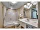 Clean bathroom featuring a shower-tub combo with a white curtain, toilet and single sink at 2501 S Ocean Blvd. # 601, Myrtle Beach, SC 29577