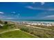 Breathtaking beach view with vibrant umbrellas and a clear ocean horizon, perfect for a tranquil getaway at 2501 S Ocean Blvd. # 601, Myrtle Beach, SC 29577