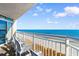 Enjoy breathtaking ocean views from this private balcony, complete with comfortable seating at 2701 S Ocean Blvd. # 1009, North Myrtle Beach, SC 29582