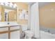 Bright bathroom with a tub and shower combination, vanity sink, and toilet for convenience at 2701 S Ocean Blvd. # 1009, North Myrtle Beach, SC 29582