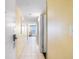 Bright hallway featuring tiled flooring, neutral walls, and access to various rooms with an ocean view at 2701 S Ocean Blvd. # 1009, North Myrtle Beach, SC 29582