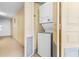 Efficient stacked washer and dryer unit located in a designated laundry closet for convenience at 2701 S Ocean Blvd. # 1009, North Myrtle Beach, SC 29582