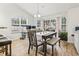 Bright dining area with wood floors, table with chairs and bench seating, and natural light at 281 Encore Circle, Myrtle Beach, SC 29579