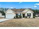 Charming single-story home with a well-manicured lawn and attached garage at 281 Encore Circle, Myrtle Beach, SC 29579