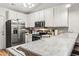 Modern kitchen with stainless steel appliances, white cabinets, and laminate countertops at 281 Encore Circle, Myrtle Beach, SC 29579