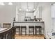 Kitchen bar with seating and stainless steel appliances, part of an open layout at 281 Encore Circle, Myrtle Beach, SC 29579