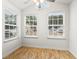 Bright living room with three windows offering natural light and showcasing the exterior view at 281 Encore Circle, Myrtle Beach, SC 29579