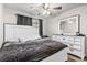 Main bedroom featuring a ceiling fan, large bed, and a white dresser with a coordinating mirror at 281 Encore Circle, Myrtle Beach, SC 29579