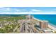 Wide aerial shot of a coastal community, beach, and oceanfront high-rise buildings at 299 Lake Arrowhead Rd., Myrtle Beach, SC 29572