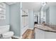 Bathroom with wood-look floors, granite vanity and a tiled shower with a glass door at 299 Lake Arrowhead Rd., Myrtle Beach, SC 29572