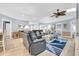 Relaxing living room with comfortable seating, light wood floors, an open layout, and a ceiling fan at 299 Lake Arrowhead Rd., Myrtle Beach, SC 29572