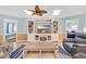 Welcoming living room with a media center, a ceiling fan, and adjacent bedrooms at 299 Lake Arrowhead Rd., Myrtle Beach, SC 29572