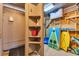 Organized storage space with shelving, a utility sink, and beach gear displayed at 299 Lake Arrowhead Rd., Myrtle Beach, SC 29572