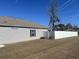 Backyard with a long white vinyl privacy fence and grass at 3009 Woodbury Ct., Conway, SC 29527