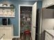 Organized walk-in pantry with shelving, storage, and an assortment of food items, drinks and small appliances at 3009 Woodbury Ct., Conway, SC 29527