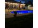 Backyard featuring a pool with blue lighting, outdoor furniture, and lush green lawn at 3009 Woodbury Ct., Conway, SC 29527