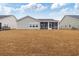 Spacious backyard with a large, screened-in porch perfect for outdoor entertaining and relaxation at 3011 Visionary Dr., Myrtle Beach, SC 29588