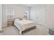 Bright bedroom featuring neutral walls, plush carpeting, and ample natural light from two windows at 3011 Visionary Dr., Myrtle Beach, SC 29588