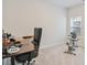 Home office with an ergonomic chair, a desk, a spin bike, and natural light streaming through a window at 3011 Visionary Dr., Myrtle Beach, SC 29588