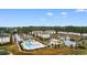 Wide aerial view of the Kiskadee Parke community amenities including pool, clubhouse, pond and tennis courts at 306 Kiskadee Loop # 4-F, Conway, SC 29526