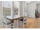 Bright dining area features a wood table, seating for four, and lots of natural light at 306 Kiskadee Loop # 4-F, Conway, SC 29526