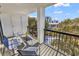 Relaxing balcony featuring outdoor seating with a view of lush greenery and building at 311 69Th Ave. N # 404, Myrtle Beach, SC 29572