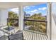 Spacious balcony featuring outdoor seating and a view of lush greenery and the building at 311 69Th Ave. N # 404, Myrtle Beach, SC 29572