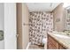 Comfortable bathroom featuring a shower with floral curtains and a sink with granite countertop at 311 69Th Ave. N # 404, Myrtle Beach, SC 29572