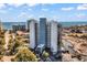 An exterior view of an oceanfront condo building on a sunny day with blue skies and landscaping at 311 69Th Ave. N # 404, Myrtle Beach, SC 29572