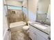 Bathroom with a tiled shower-tub, a sink with a granite countertop and a framed mirror at 311 Las Olas Dr., Myrtle Beach, SC 29577