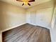 Bedroom with a ceiling fan, a closet and grey wood-look floors with light-colored walls and trim at 311 Las Olas Dr., Myrtle Beach, SC 29577