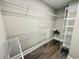 Walk-in closet with wire shelving and wood-look flooring at 311 Las Olas Dr., Myrtle Beach, SC 29577