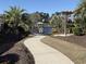 Picturesque view of a community dock and waterfront, complete with walkway and nearby pergola at 311 Las Olas Dr., Myrtle Beach, SC 29577