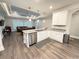 Open-concept kitchen with granite countertops, ample cabinet space, and an island overlooking the living area at 311 Las Olas Dr., Myrtle Beach, SC 29577