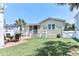 Charming backyard with a lush lawn, patio, and exterior view of the home's porch at 317 23Rd Ave. N, North Myrtle Beach, SC 29582