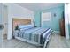 Bedroom with a bed with a wood headboard, light colored walls, and natural light at 317 23Rd Ave. N, North Myrtle Beach, SC 29582