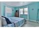 Bright bedroom offers light colored walls, a comfortable bed, and natural light at 317 23Rd Ave. N, North Myrtle Beach, SC 29582