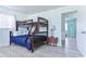 Bedroom features bunk beds with a wood frame, light colored walls, and natural light at 317 23Rd Ave. N, North Myrtle Beach, SC 29582