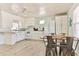 Bright kitchen featuring white cabinetry, modern appliances, and a cozy dining area, great for Gathering meals at 317 23Rd Ave. N, North Myrtle Beach, SC 29582