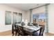 Well-lit dining room with a sleek black table set and decorative art pieces at 333 Rookroost Circle, Conway, SC 29526