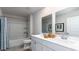 Bright bathroom with a dual sink vanity, a bathtub, and a shower behind a blue curtain at 344 Rookroost Circle, Conway, SC 29526