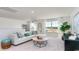 Bright living room with white walls, comfortable seating, and natural light from large windows at 344 Rookroost Circle, Conway, SC 29526