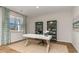 Bright office space featuring two bookcase shelves, a large desk, and natural light at 344 Rookroost Circle, Conway, SC 29526