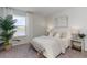 Cozy bedroom featuring large window with a view, neutral decor, and stylish furnishings at 348 Rookroost Circle, Conway, SC 29526