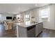 Kitchen island with granite countertop and stainless steel appliances opens to the living room at 348 Rookroost Circle, Conway, SC 29526