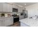 Stylish kitchen with granite countertops, stainless steel appliances, and sleek gray cabinets at 348 Rookroost Circle, Conway, SC 29526